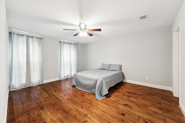 bedroom with wood-type flooring and ceiling fan