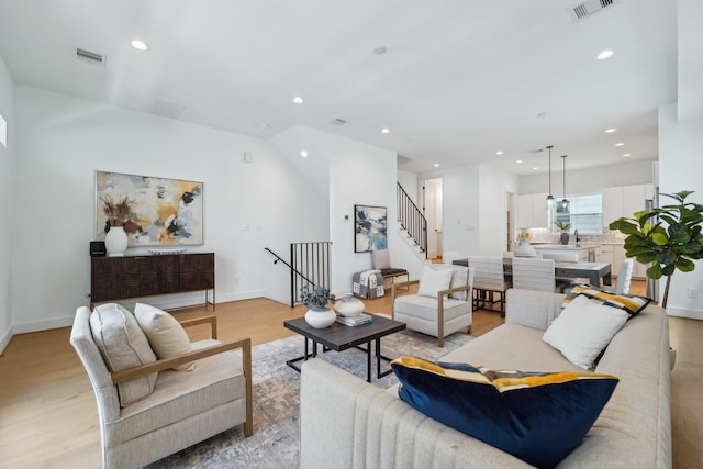 living room with light hardwood / wood-style flooring