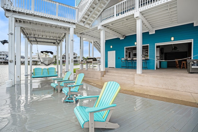 wooden terrace featuring an outdoor bar