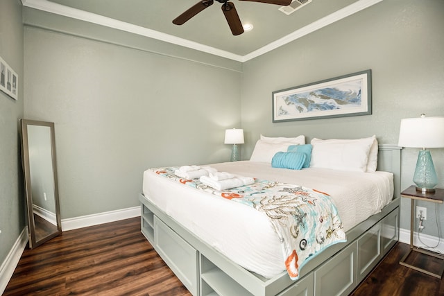 bedroom featuring ceiling fan, dark hardwood / wood-style flooring, and ornamental molding