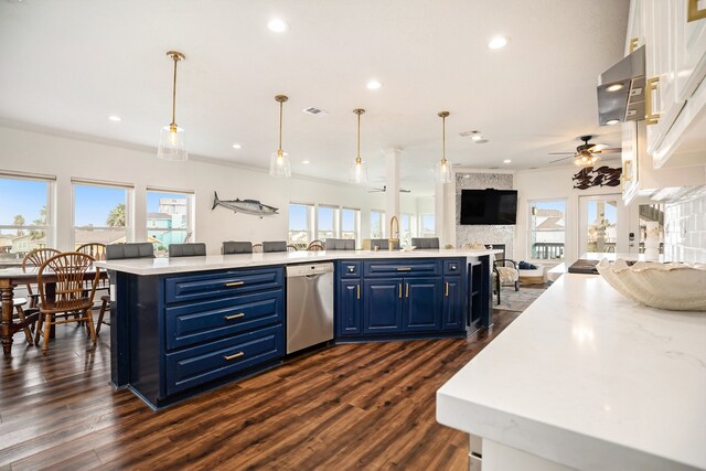 kitchen with decorative light fixtures, stainless steel dishwasher, blue cabinets, and ceiling fan