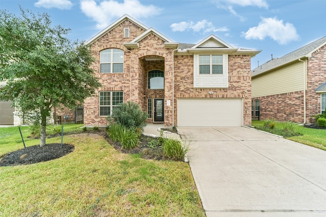 view of front of home with a garage and a front lawn