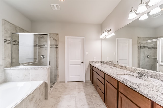 bathroom with vanity and separate shower and tub