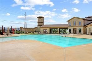 view of pool featuring a patio area