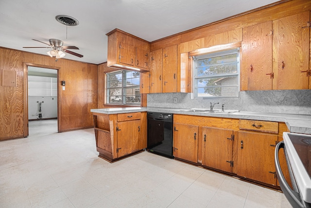 kitchen with backsplash, black dishwasher, sink, stainless steel range oven, and ceiling fan