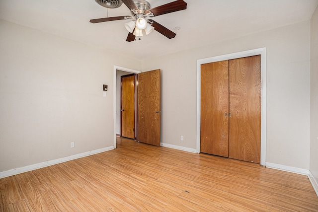 unfurnished bedroom with ceiling fan, a closet, and light hardwood / wood-style flooring