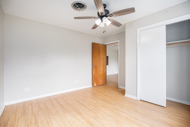 unfurnished bedroom featuring ceiling fan and light wood-type flooring