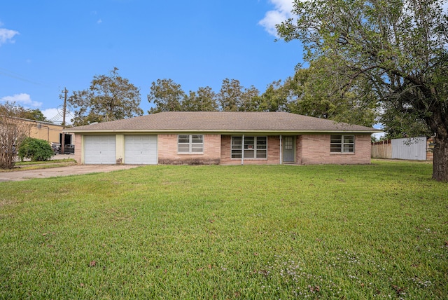 single story home with a front yard and a garage