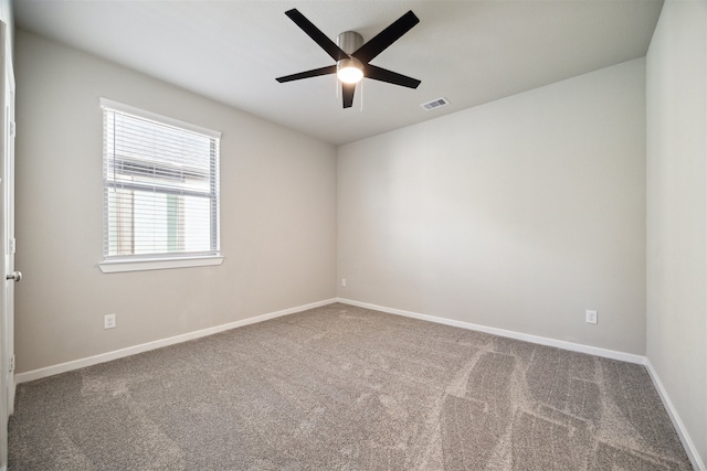 spare room with carpet and ceiling fan