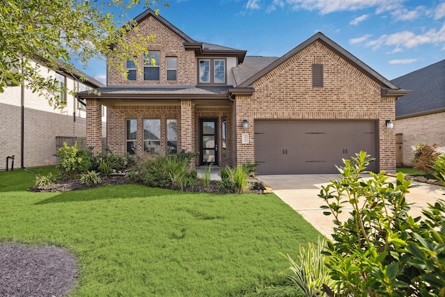 view of front of property with a garage and a front lawn