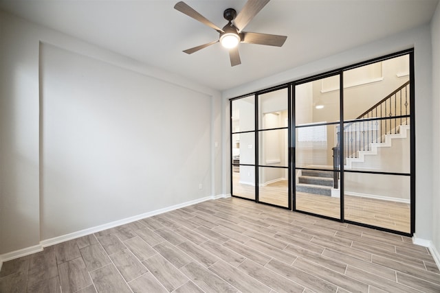 unfurnished room featuring ceiling fan and light hardwood / wood-style flooring