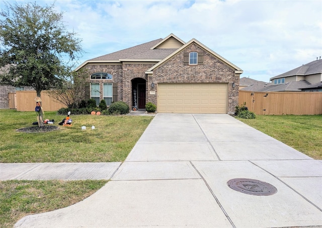 view of front facade featuring a garage and a front yard