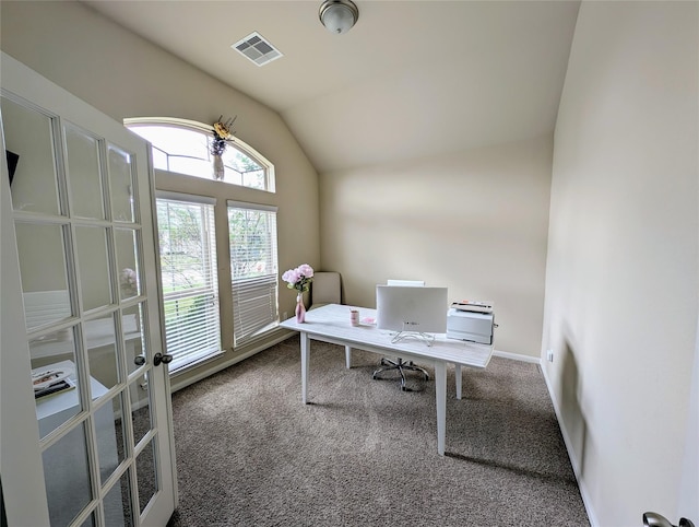 carpeted office featuring lofted ceiling