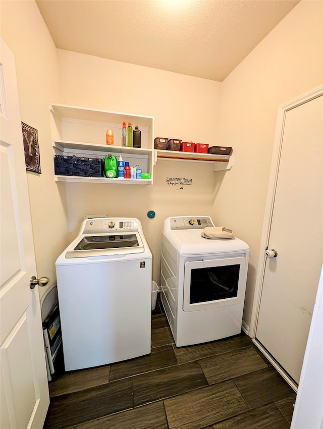 washroom with separate washer and dryer and a textured ceiling