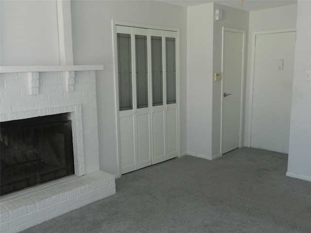 unfurnished living room featuring a fireplace and light colored carpet