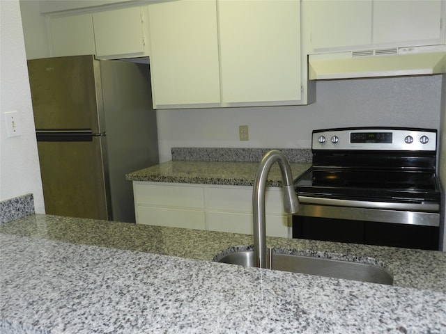 kitchen featuring light stone counters, stainless steel appliances, extractor fan, sink, and white cabinets