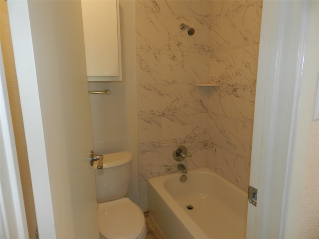 bathroom with toilet and tub / shower combination