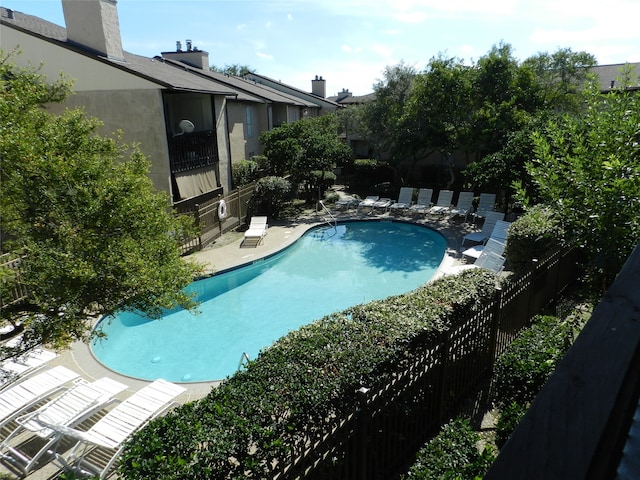 view of swimming pool with a patio area