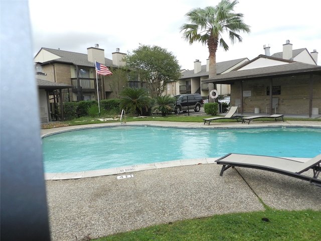 view of swimming pool featuring a patio