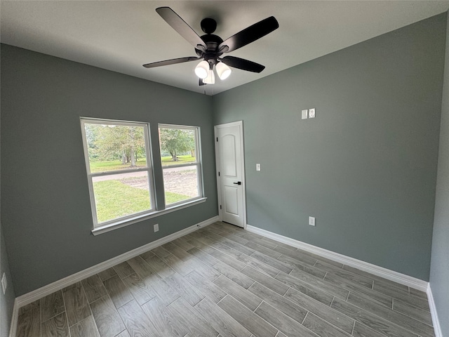 spare room with ceiling fan and light hardwood / wood-style floors