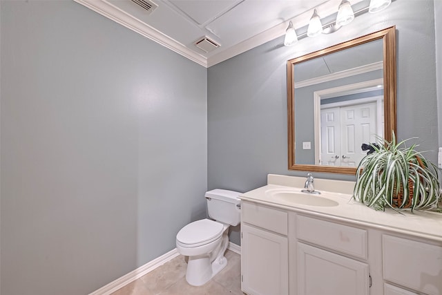 bathroom with toilet, tile patterned flooring, vanity, and crown molding