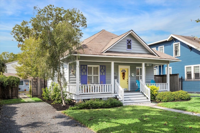 view of front of house featuring a front lawn and a porch