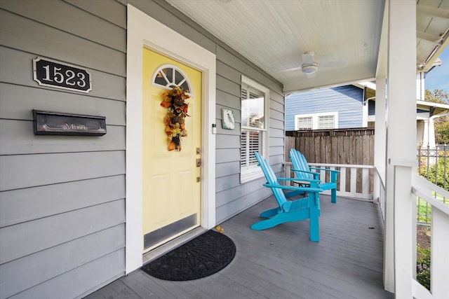 view of exterior entry with a porch