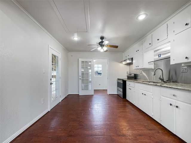 kitchen featuring white cabinetry, plenty of natural light, stainless steel electric range oven, and sink