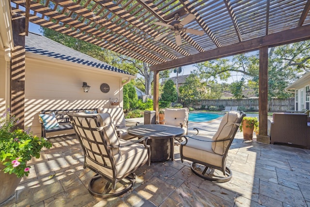 view of patio featuring a pergola, ceiling fan, and a fenced in pool