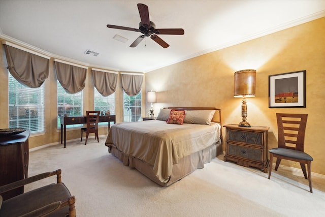 bedroom with ceiling fan, light carpet, and ornamental molding