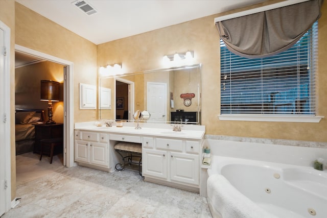 bathroom featuring vanity and a bathing tub
