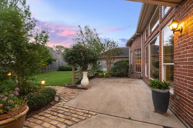 patio terrace at dusk with a lawn