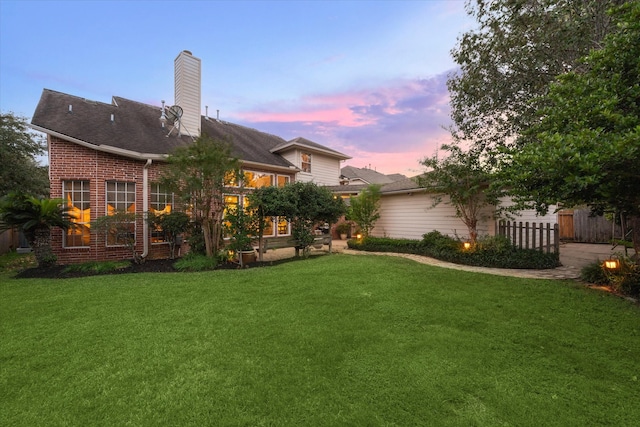 view of yard at dusk