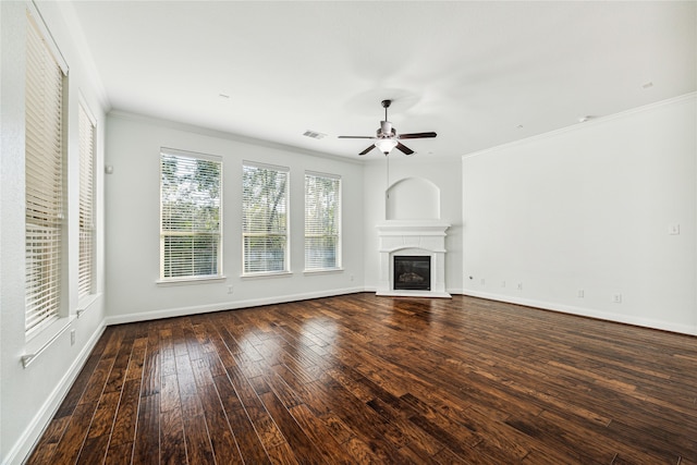 unfurnished living room with ornamental molding, ceiling fan, and dark wood-type flooring