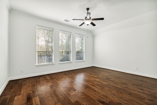 unfurnished room with ornamental molding, vaulted ceiling, ceiling fan, and dark wood-type flooring