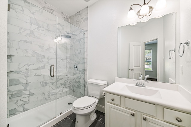 bathroom with tile patterned flooring, vanity, toilet, and walk in shower