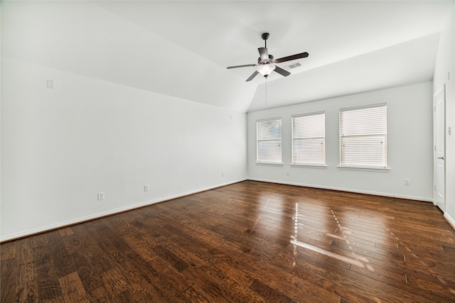 empty room with dark hardwood / wood-style floors, ceiling fan, and vaulted ceiling