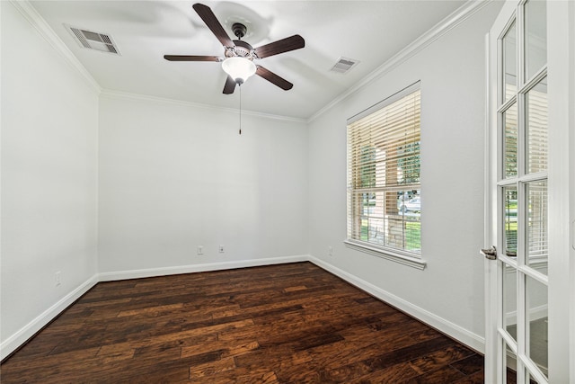 empty room featuring ornamental molding, ceiling fan, and dark wood-type flooring