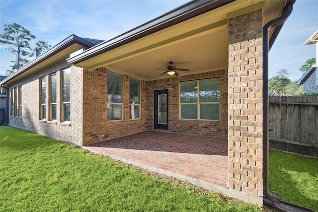 exterior space with ceiling fan