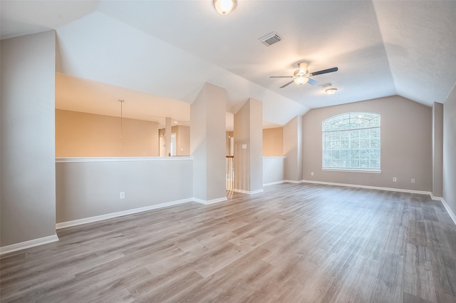 interior space with hardwood / wood-style floors, ceiling fan, and vaulted ceiling