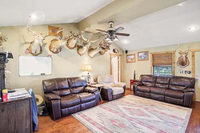 living room featuring ceiling fan, wood-type flooring, and lofted ceiling with beams