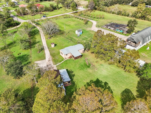 birds eye view of property featuring a rural view