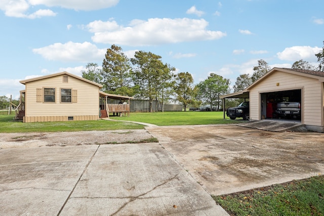 view of property exterior with an outbuilding, a garage, a lawn, a carport, and a wooden deck