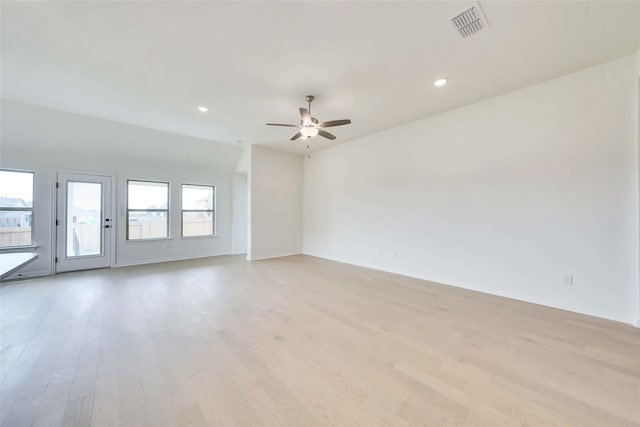 spare room with ceiling fan and light hardwood / wood-style floors