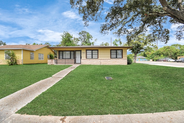 ranch-style house with a front lawn