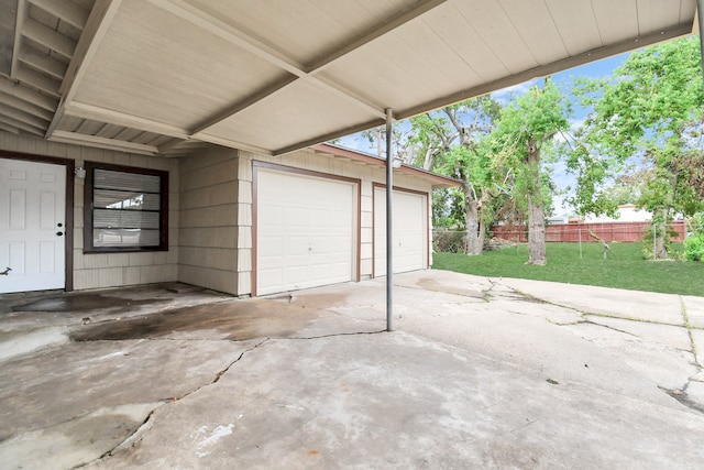 garage featuring a lawn