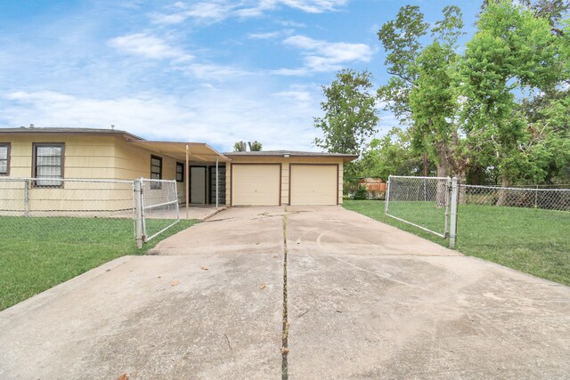 single story home featuring a front lawn and a garage