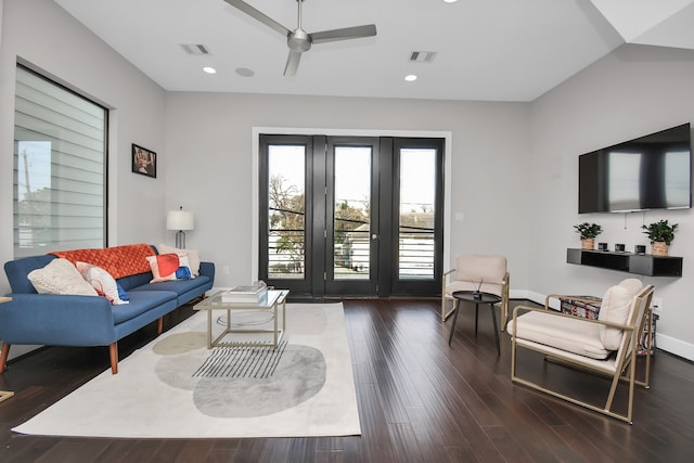 living room with dark hardwood / wood-style flooring and ceiling fan