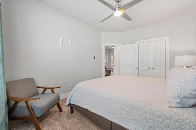 bedroom featuring carpet floors, ceiling fan, and a closet