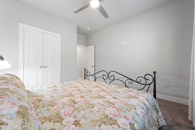 carpeted bedroom featuring a closet and ceiling fan